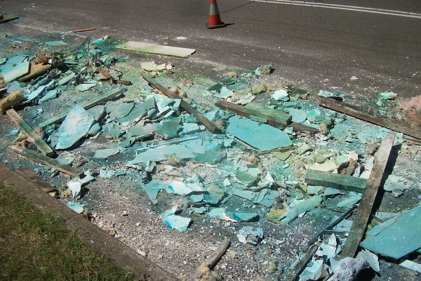 Building materials lie strewn across Boundary Road at Chester Hill.