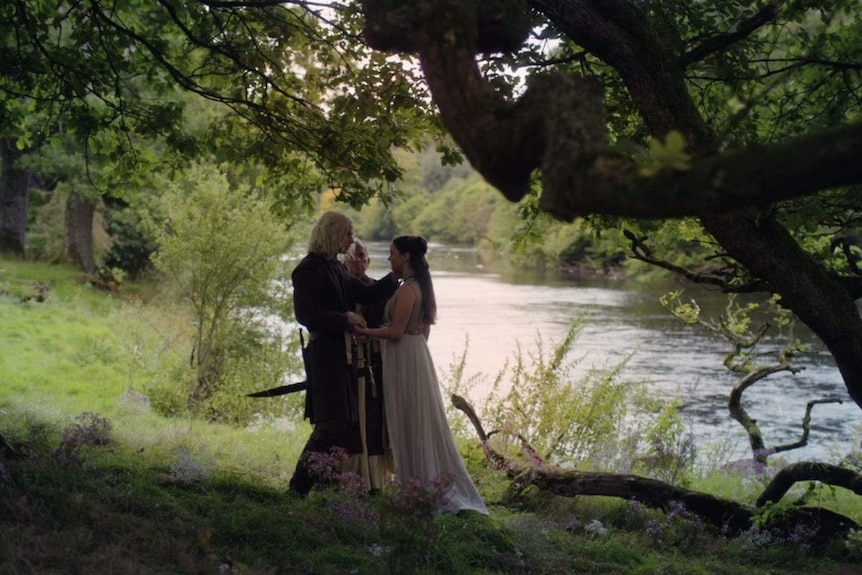 Rhaegar Targaryen and Lyanna Stark tie the knot in a low-key wedding alone by a river bank with a priest.
