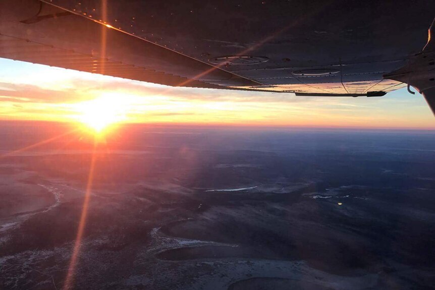 Sun over horizon as seen from light aircraft.