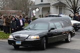 The funeral procession of Noah Pozner leaves the funeral home.