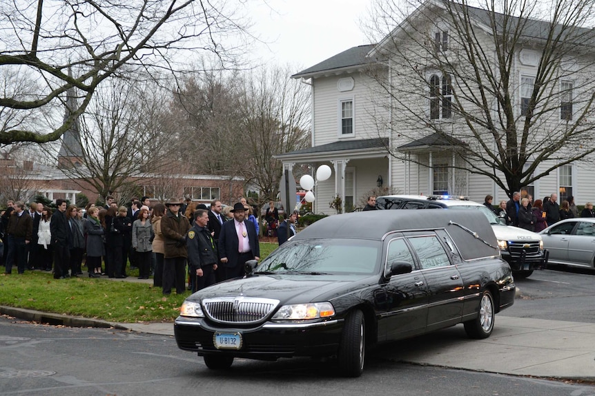 The funeral procession of Noah Pozner leaves the funeral home.