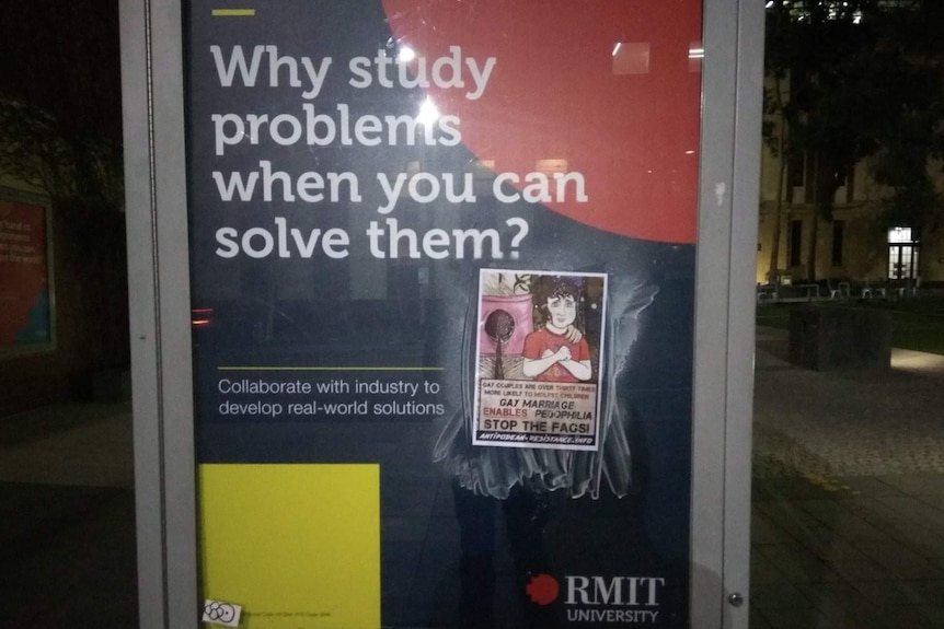 Homophobic poster roughly glued on an RMIT billboard in Melbourne's CBD.