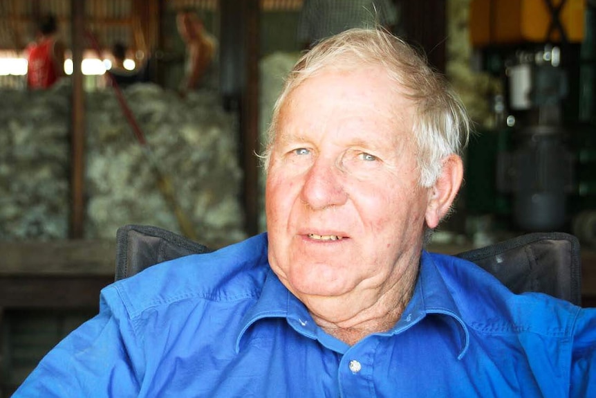 Grazier Peter Clark sitting in a shearing shed at his sheep property near Longreach in Queensland