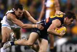 Luke Shuey of West Coast is tackled