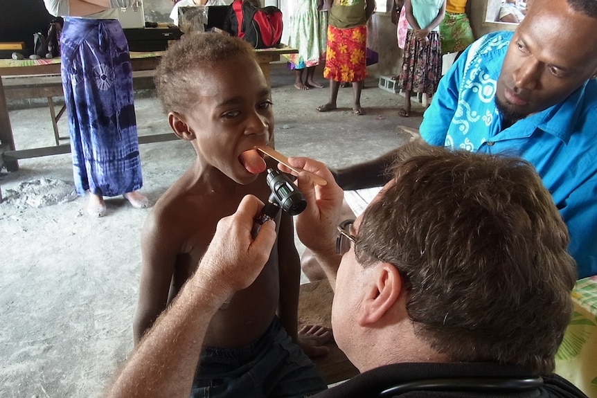 Young boy being examined 