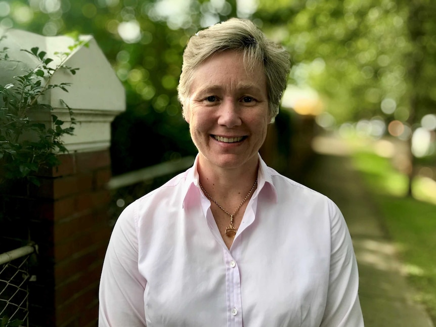 JP Morgan Australia chief economist Sally Auld stands in her front garden.