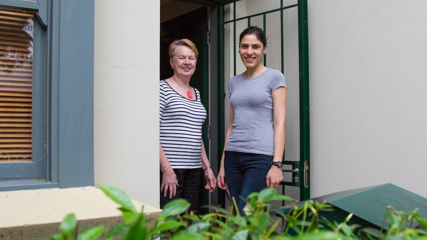 Barbara Squires and student Niloufar Imanriad outside their Redfern home