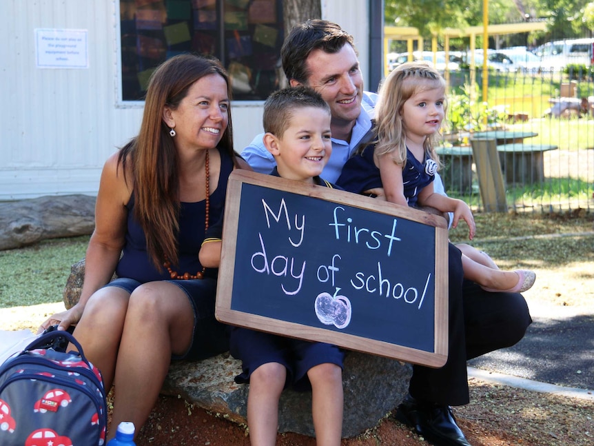 Bailey Hams, 5, with mum Stacey, dad Craig and sister Lily, 2, on his first day of kindergarten.
