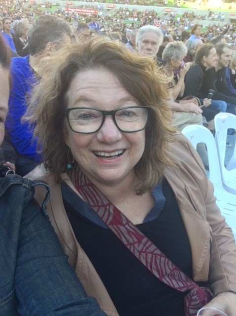 Nijole Lucinskaite sits at a concert.