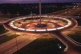 Hovenring elevates cyclists above traffic.