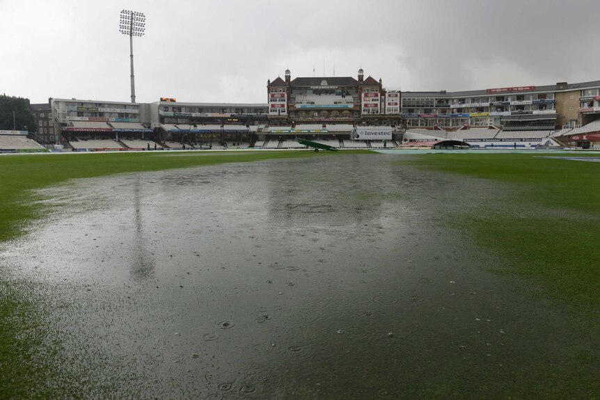 Puddles form on the field at The Oval as play is abandoned for the day during day four of the fifth Ashes Test.