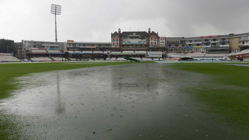 Puddles form on the field at The Oval as play is abandoned for the day during day four of the fifth Ashes Test.