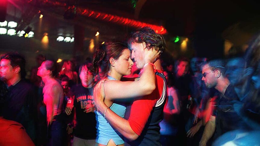 Modern Day Tribe: a couple dance at a rave
