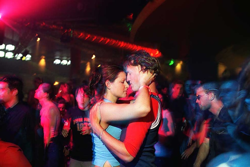 Modern Day Tribe: a couple dance at a rave