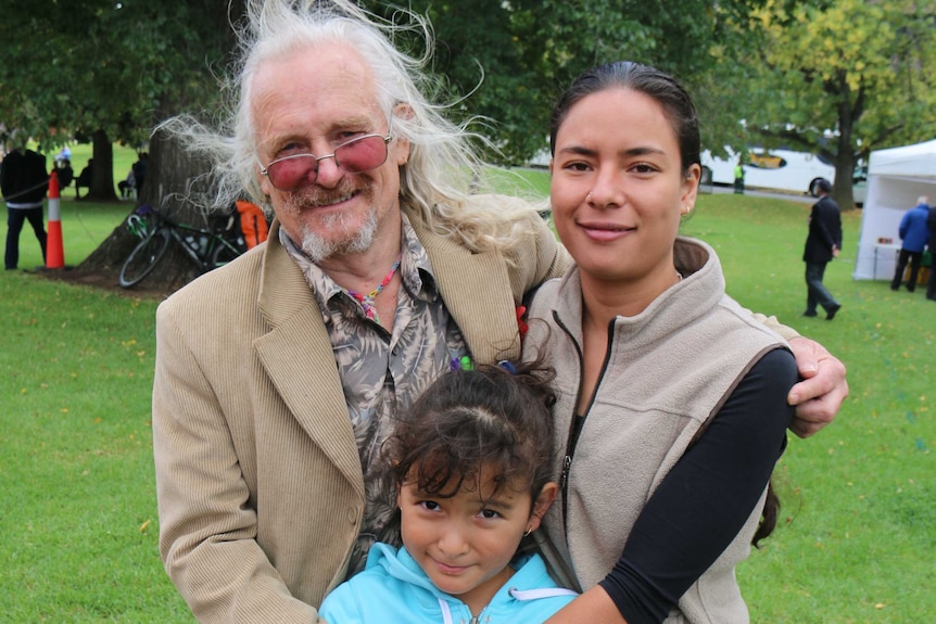 Jim Fletcher with his daughters at the Anzac Day march.