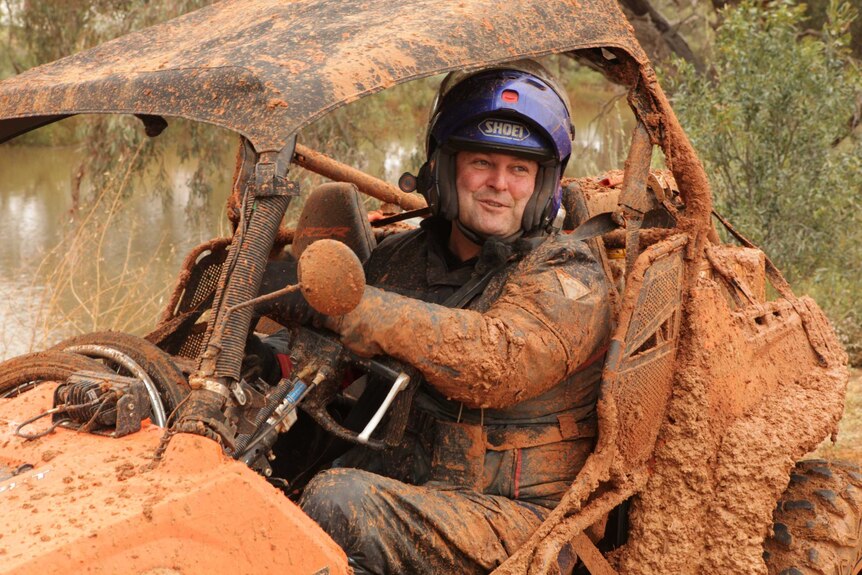 Jim covered in mud