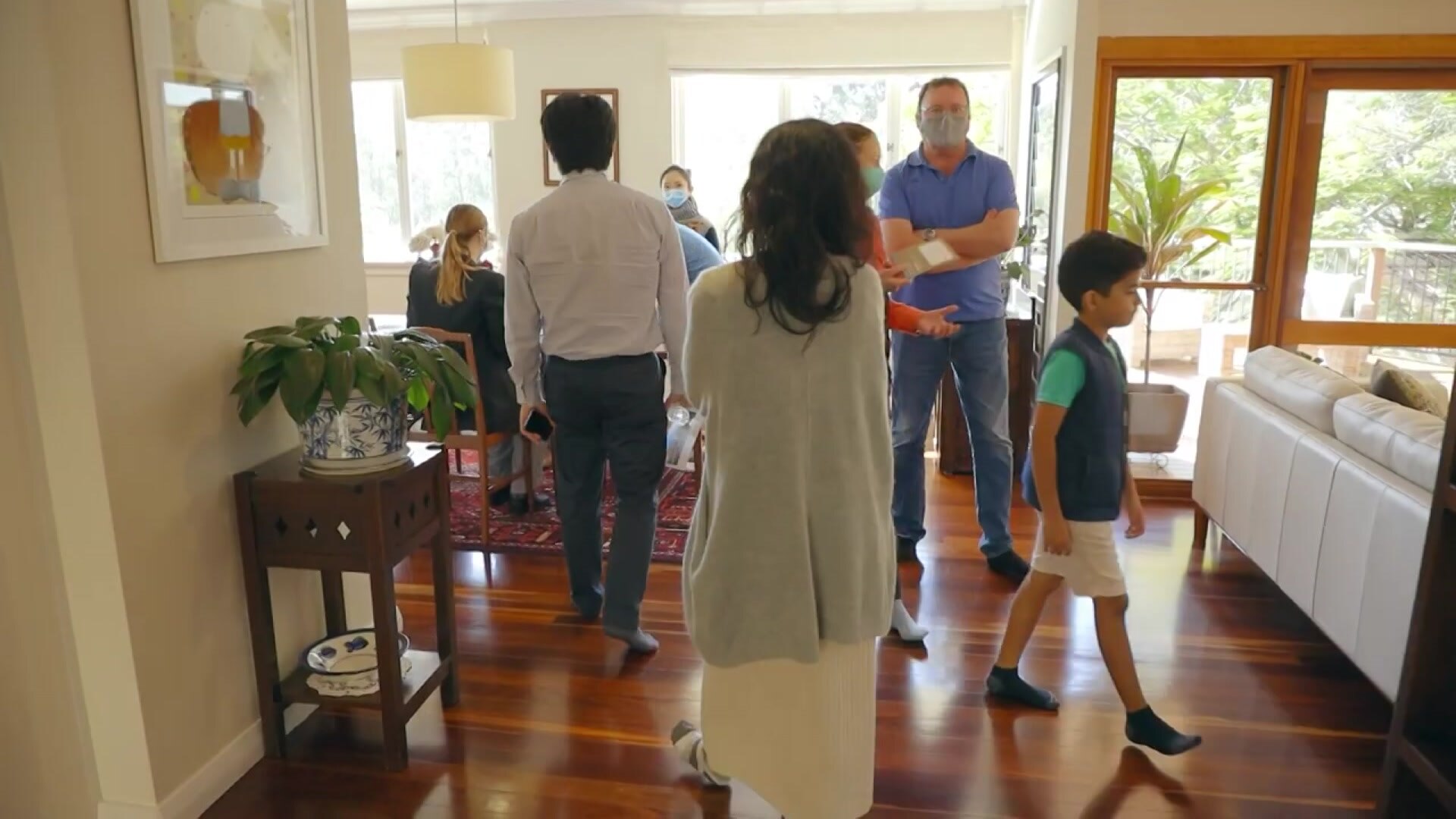 People looking at 26 Cadiz Street, Indooroopilly, which sold at auction