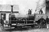 The Ballaarat Locomotive, surrounded by men, in a Ballarat train yard in 1871.