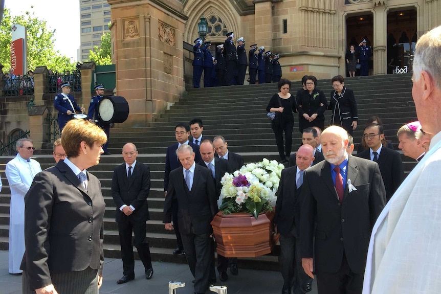 Coffin of Curtis Cheng leaves St Mary's Cathedral