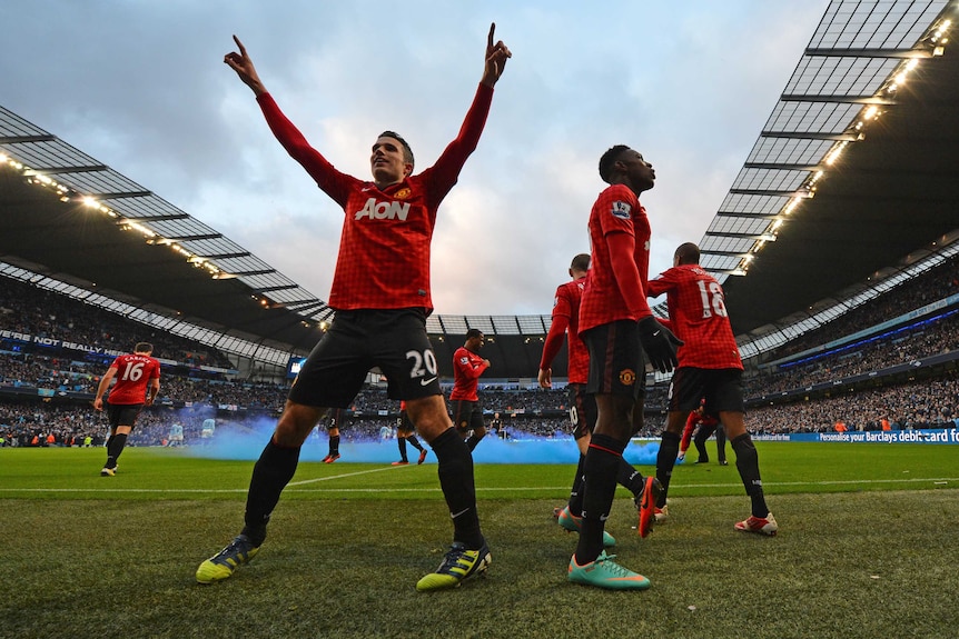 Derby delight ... Robin Van Persie (L) celebrates after a 3-2 win over Manchester City.