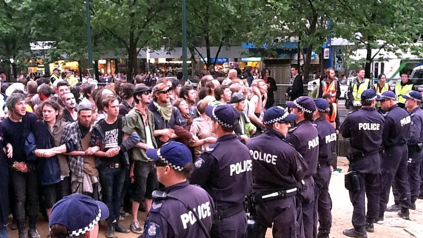 Police and activists stand off at the site of the Occupy Melbourne protests.