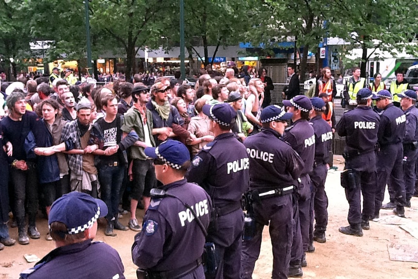 Police and activists stand off at the site of the Occupy Melbourne protests.