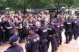Police and activists stand off at the site of the Occupy Melbourne protests.