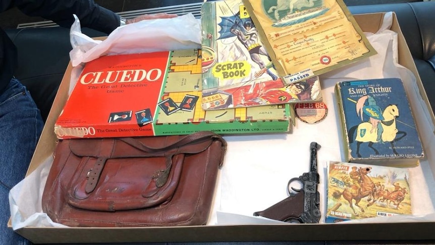 Leather bag, Cluedo boardgame and books