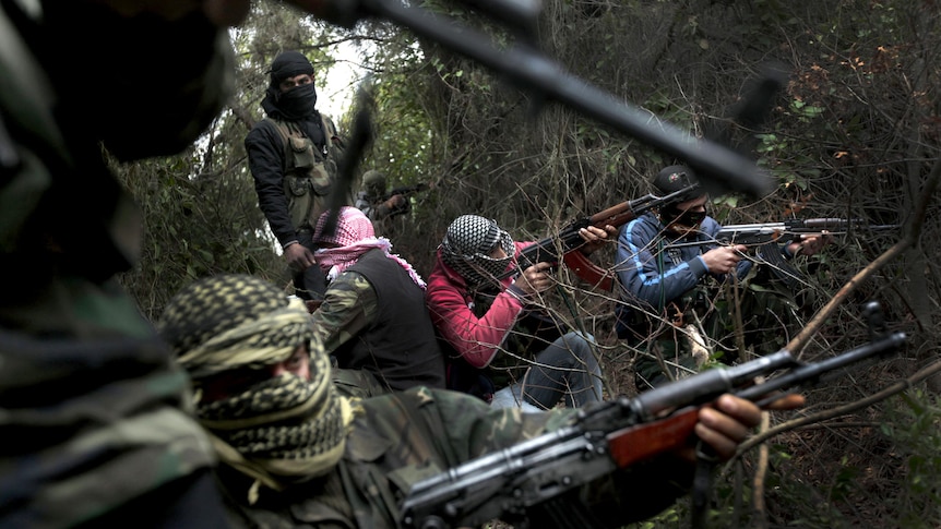 Free Syrian Army gather in the hills of the Idlib province.