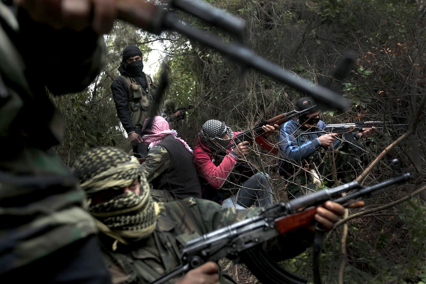 Free Syrian Army gather in the hills of the Idlib province.