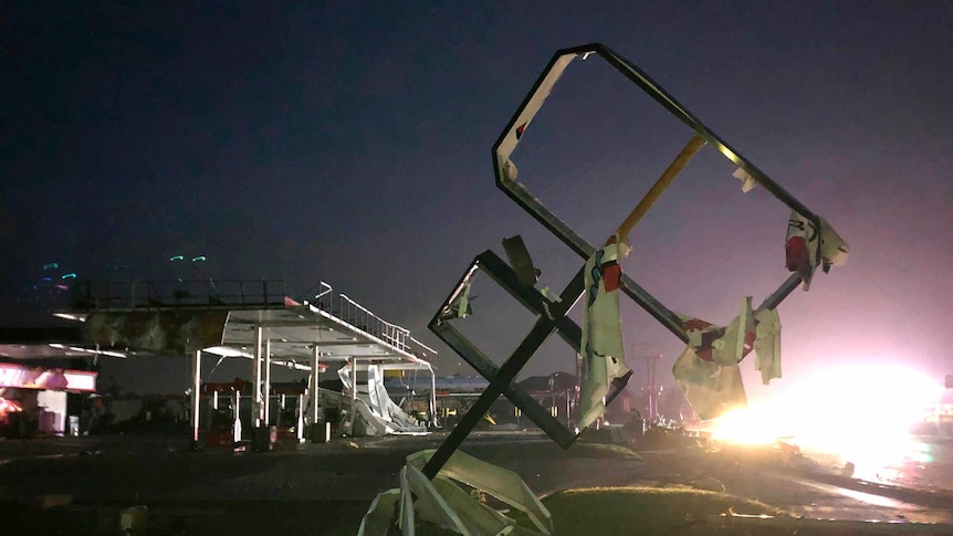 A destroyed sign for a car wash is seen in tornado-hit Jefferson City.