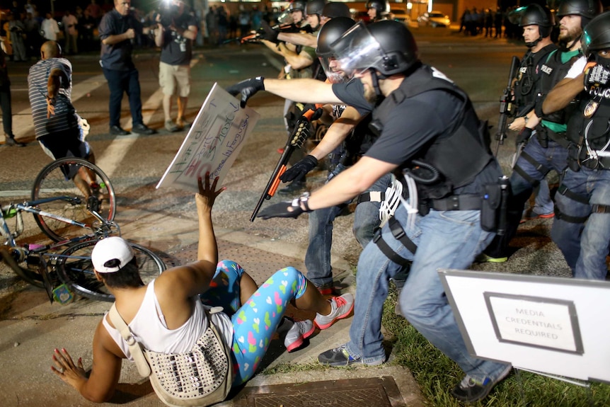 Police officers arrest a demonstrator in Ferguson, Missouri.