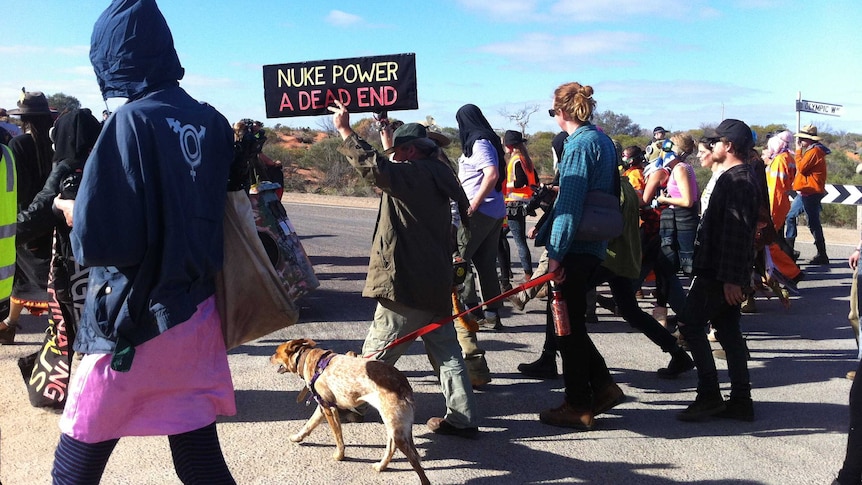 About 150 people take part in a "zombie march" near Olympic Dam mine.