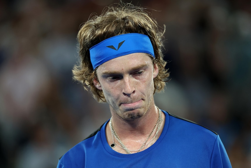 A Russian male tennis players looks dejected during an Australian Open match.