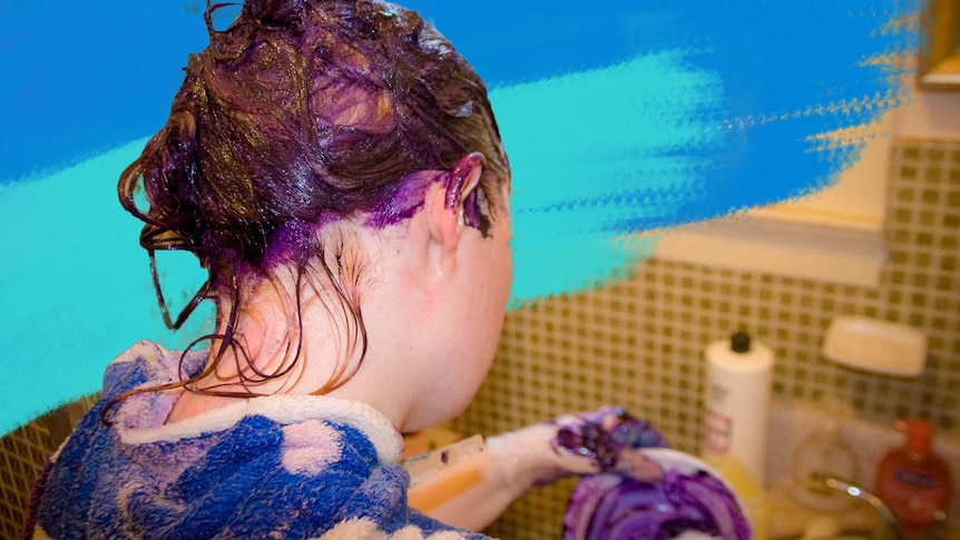 Back of a woman's head covered in purple hair dye for a story about the dos and don'ts of colouring hair at home.