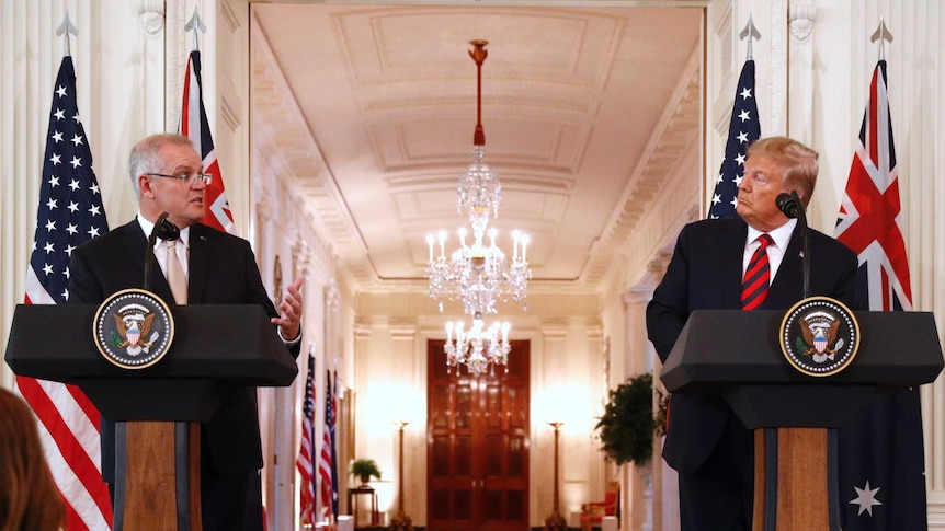 Australian Prime Minister Scott Morrison speaks as US President Donald Trump looks at him during a joint press conference.