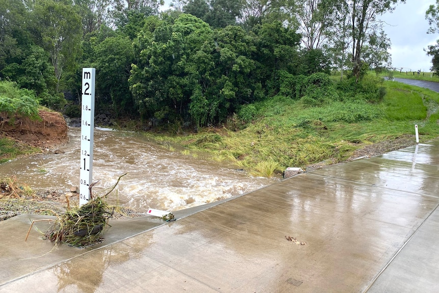 A small bridge creek crossing where a man's car was swept away