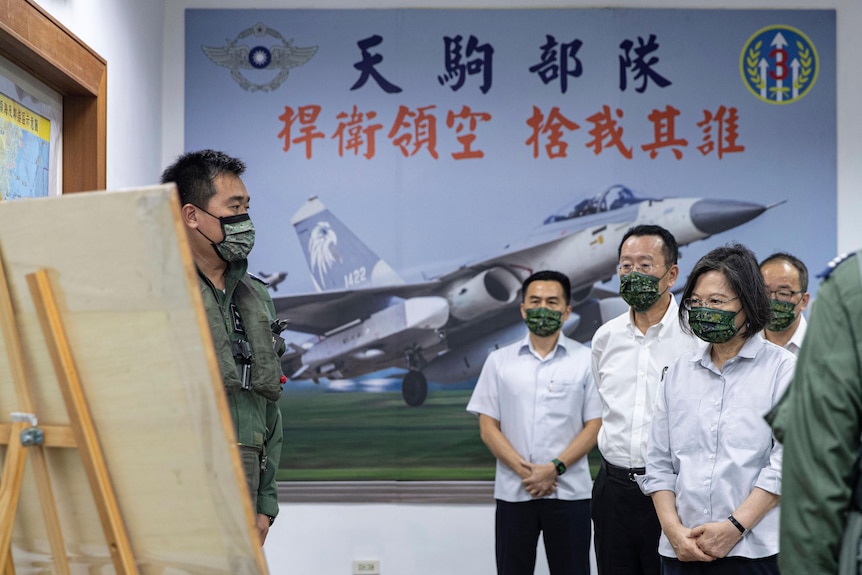 President Tsai Ing-wen, right, is briefed during a visit to a naval station on Penghu.