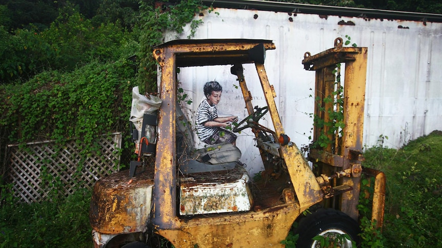 Painting of a boy playing on an old forklift