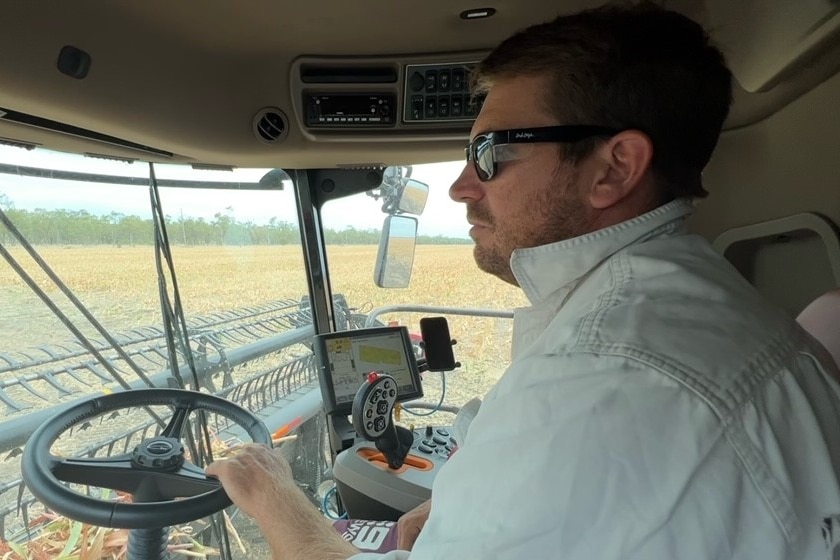 Daniel Skerman driving a farming machine. 