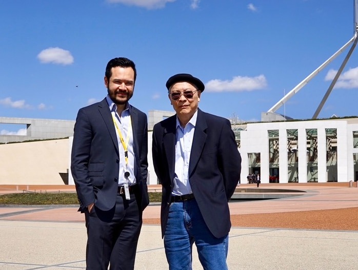 Jason Om with his Cambodian father, visiting Parliament House in 2015.