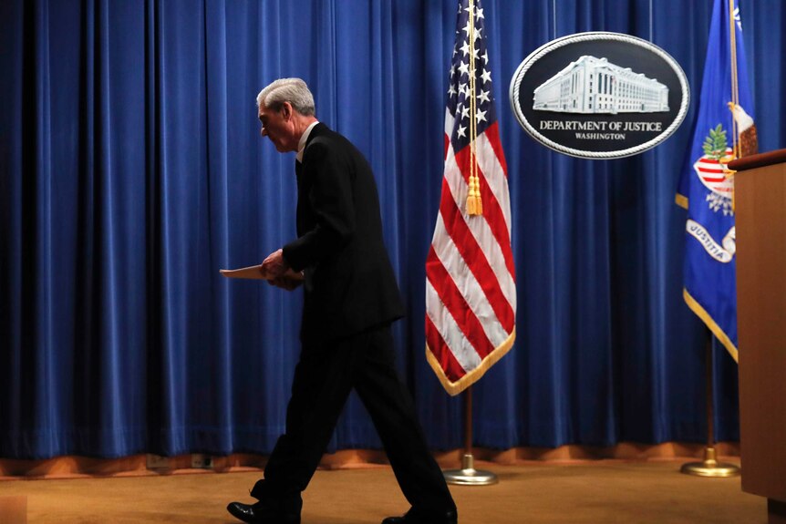 Special counsel Robert Muller walks from the podium