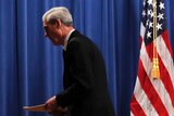 Special counsel Robert Muller walks from the podium