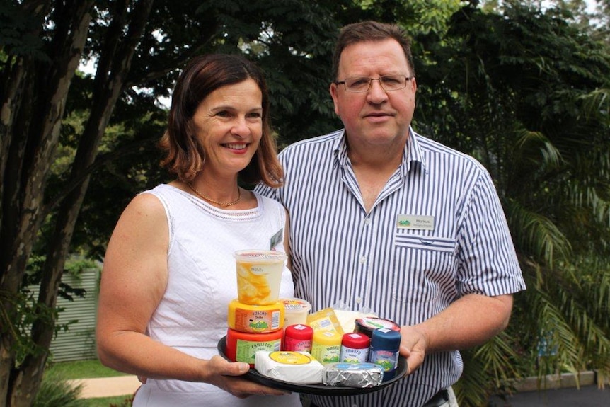 The couple with a range of their yoghurts and cheese