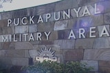 A block wall with punckpunyal camp base in big letters on it.