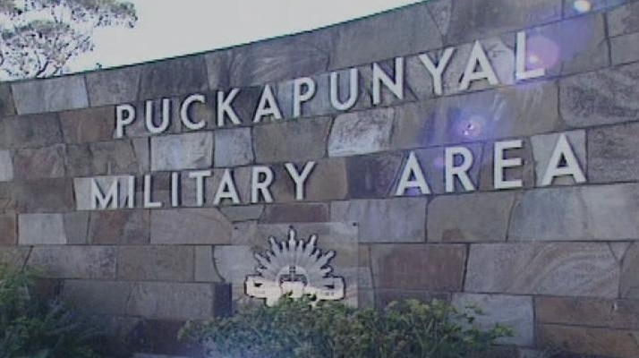 A stone wall with lettering that reads "Puckapunyal Military Area".