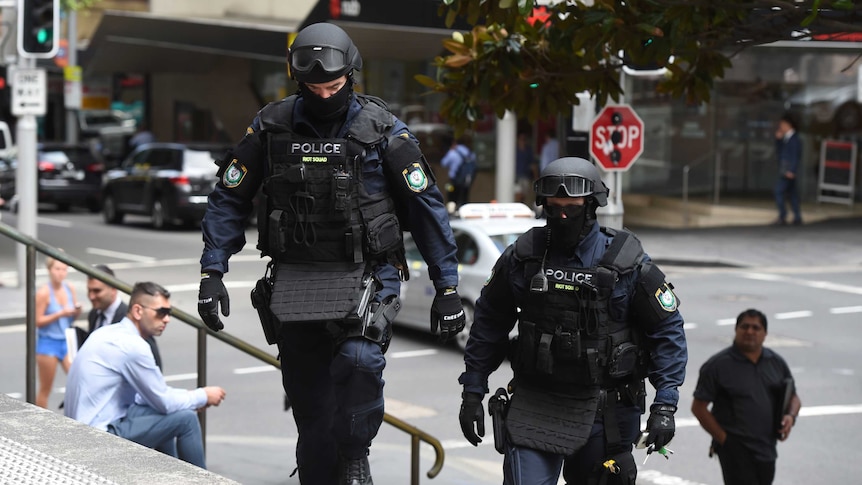 NSW riot police enter the Downing Centre Local Court in Sydney