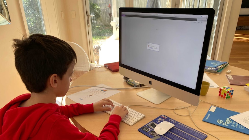 Student sitting at computer at home unable to log in.