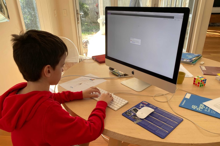 Student sitting at computer at home unable to log in.