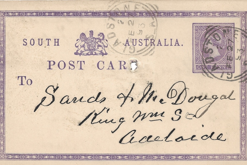 An old postcard with ornate handwriting on the front